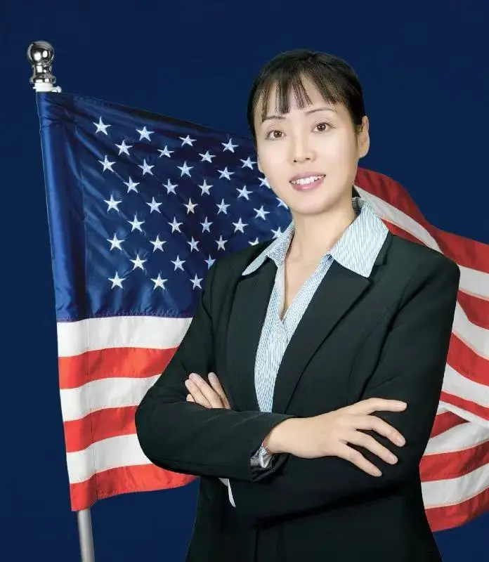 Woman with American flag in background.
